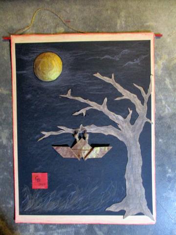 Black background page with golden moon in distance. Brown, baron tree with an origami bat hanging from a branch. 