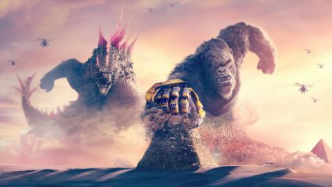 An image of Godzilla and Kong with a pink and yellow sky as the backdrop.