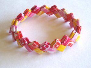 Bracelet made of pink, yellow and red candy wrappers.