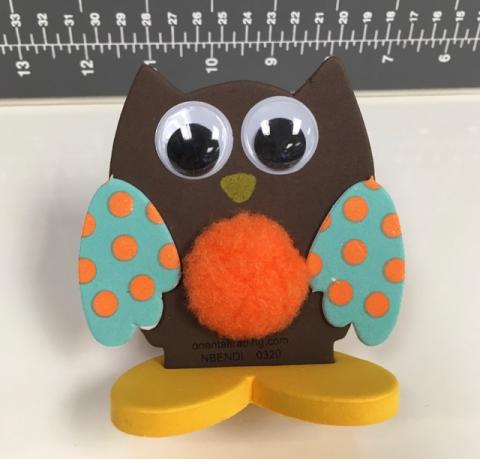 Foam owl kids craft with fuzzy middle and foam wings.