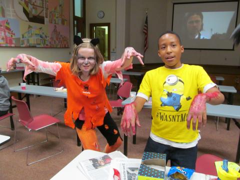 Teens portraying zombies at Halloween teen event
