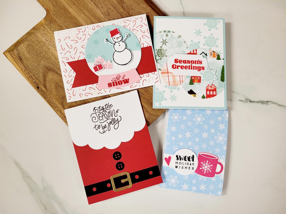 Photo of four holiday-themed greeting cards