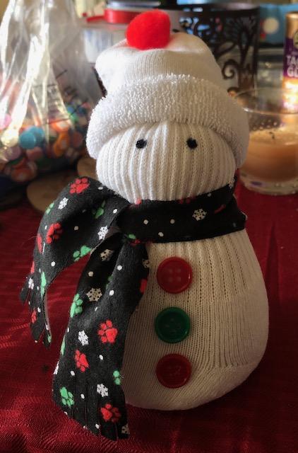 Make a Sock Snowman to bring you cheer throughout the winter!