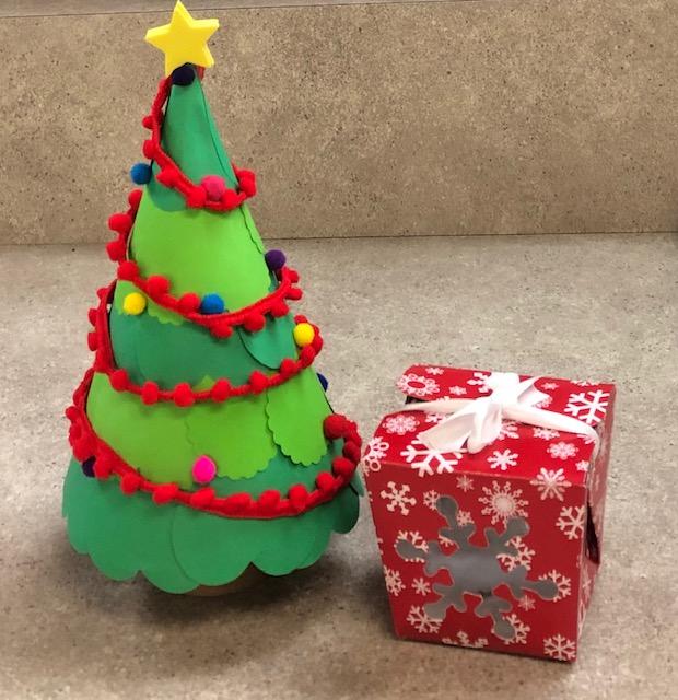 Create a sweet Holiday Tree with Gift/Treat Box using paper, ribbon, pom-poms and party hats!
