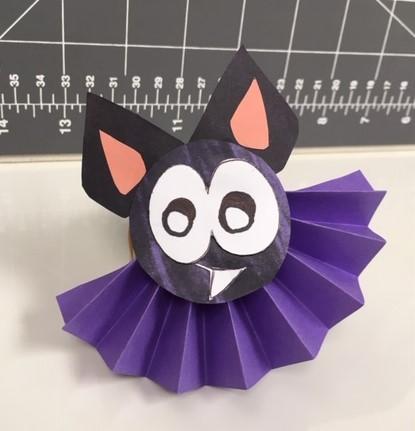 halloween paper bat with purple accordion wings