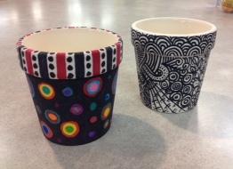 Use Sharpies to color a small ceramic pot.