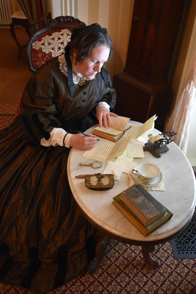 Elizabeth Cady Stanton performer writing at desk